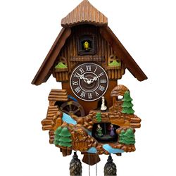 Battery operated cuckoo clock in a traditional chalet styled case with dummy weights, cuckoo, automata dancers and waterwheel. 