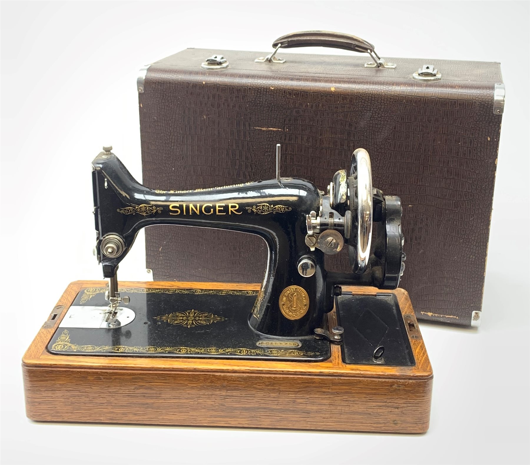 A vintage mid 20th Century cased Singer manual sewing machine
