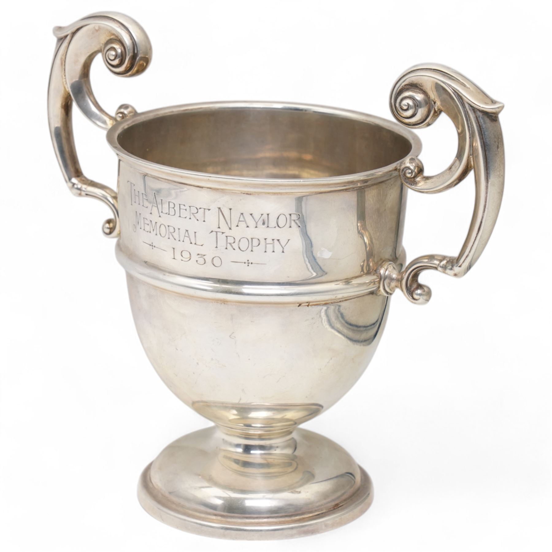 'The Albert Naylor Memorial Trophy' - A two handled silver cup with scroll handles and circular foot H19cm Sheffield 1927 Maker James Deakin & Sons 