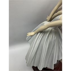Lladro figure group, 'Merry Ballet', modelled as two ballerinas in dancing pose, raised on a turned socle base, no. 5035, printed marks beneath, H49cm