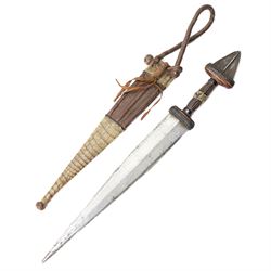 North African arm dagger with leather sheath and one other African dagger (2)