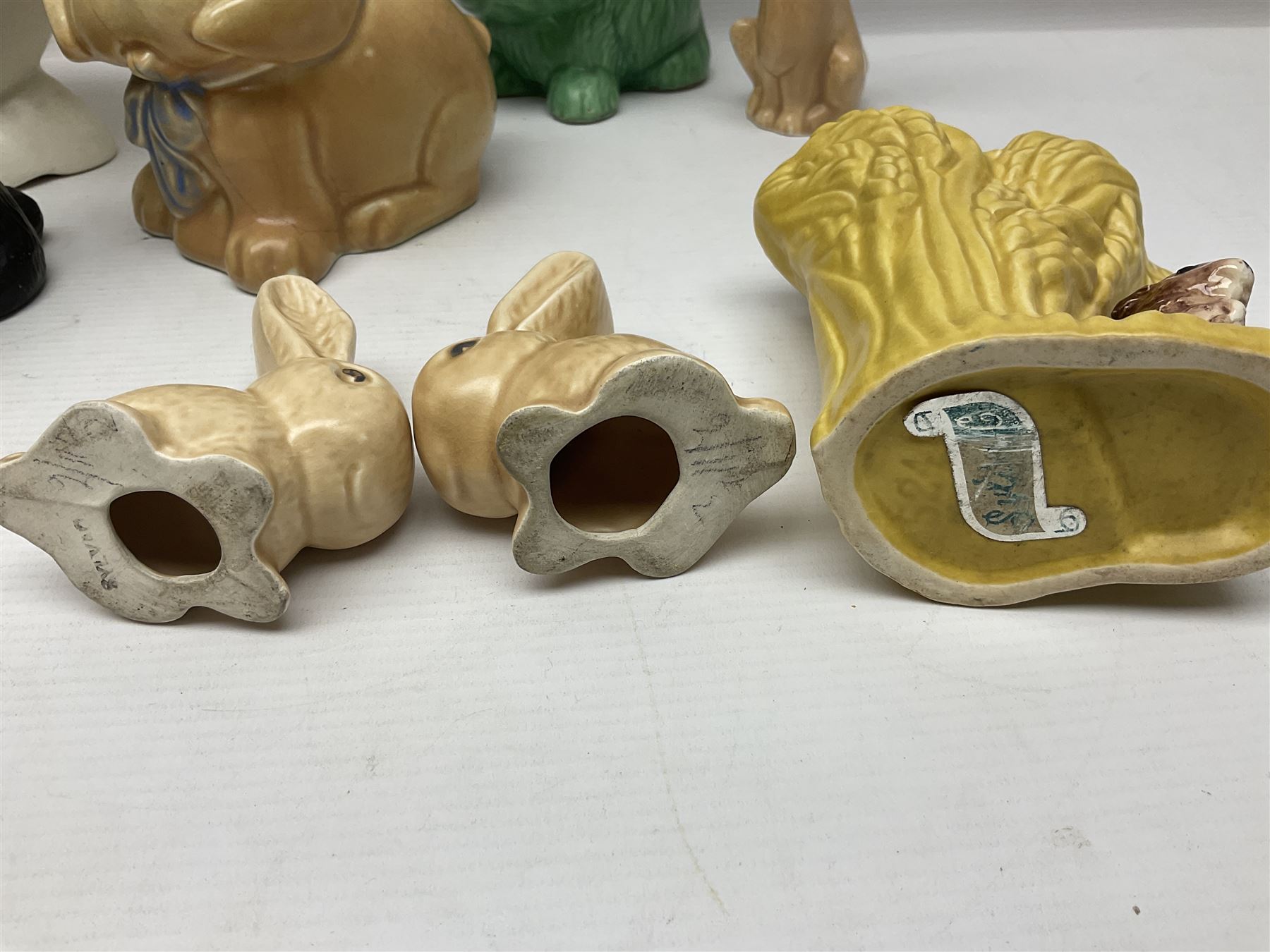 Collection of Sylvac and similar animal figures, including rabbits, hares and dogs, together with Falcon budgie vase, etc 