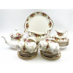 Royal Albert Old Country Roses pattern tea and dinner wares, comprising teapot, six teacups and six saucers, milk jug, open sucrier, cake plate, six dinner plates, six side plates, six bowls, and sauce boat and stand. 