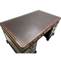 Large Georgian design mahogany twin pedestal partner's desk, moulded rectangular top with canted corners and inset leather writing surface, fitted with nine drawers and two cupboards, the pedestals with canted uprights decorated with blind fretwork, on ogee bracket feet