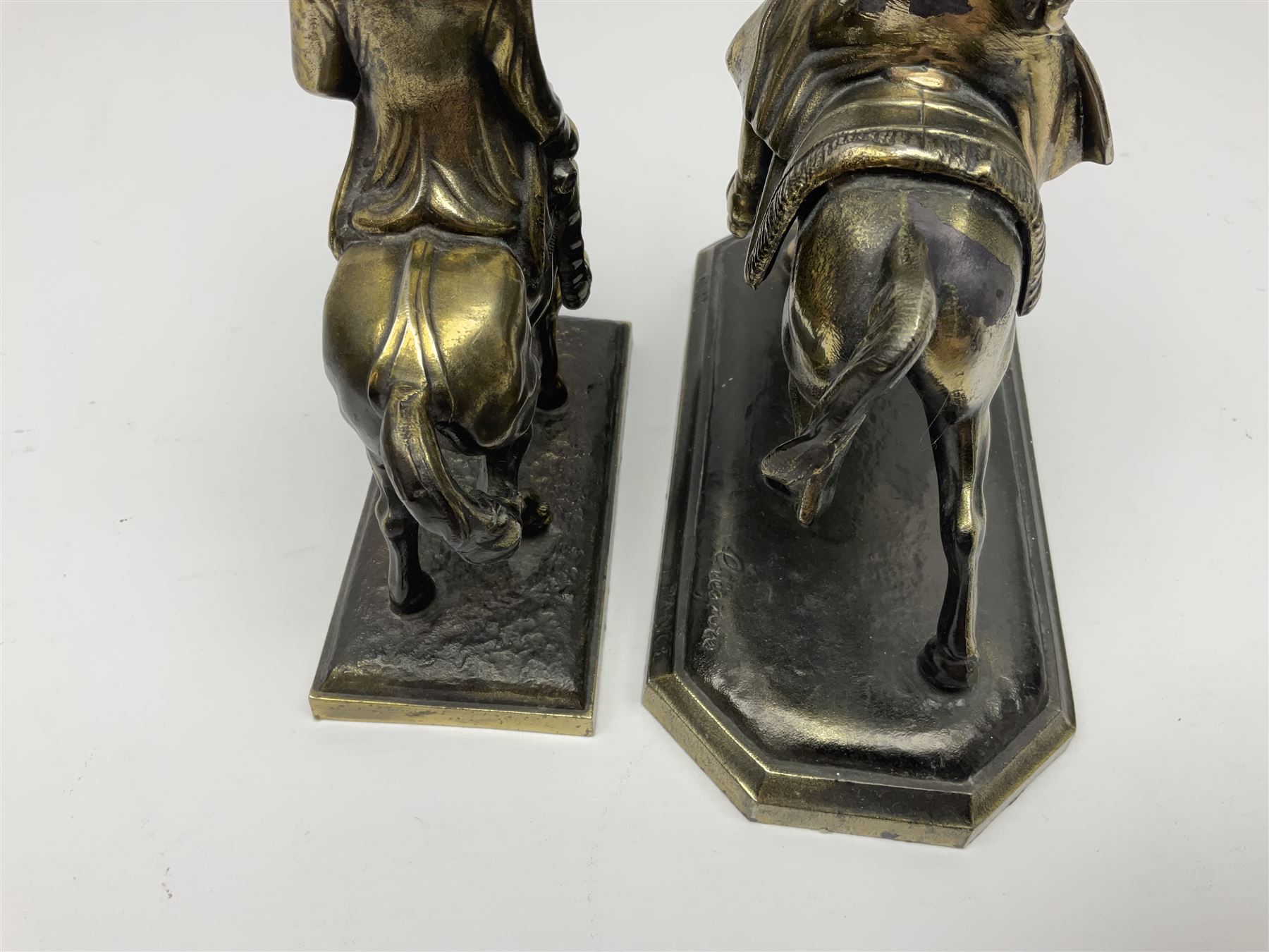 Two figures of Napoleon on horseback, one example standing on octagonal bases marked 'G R France' indistinctly signed, the other on a rectangular base, H19cm 