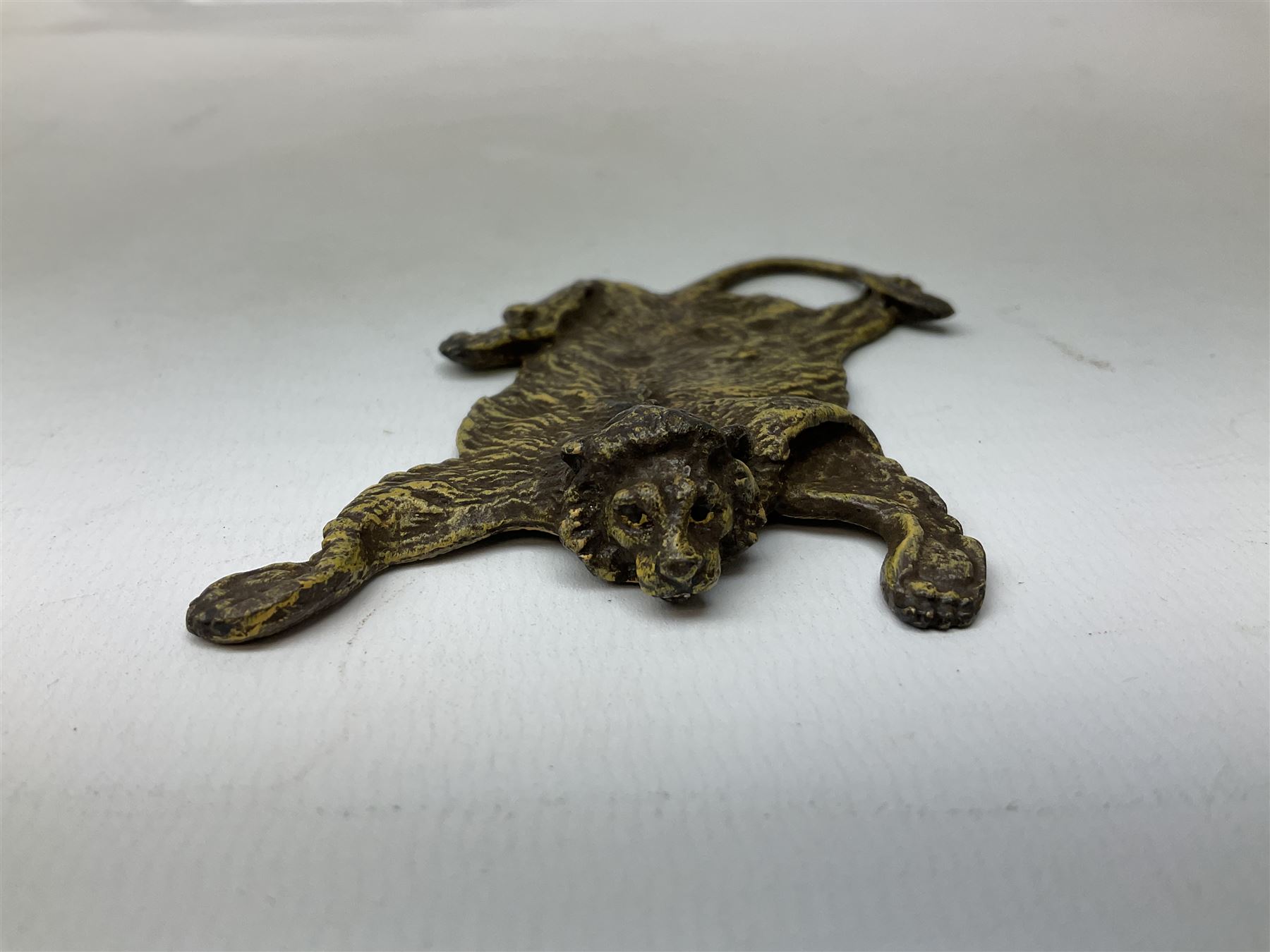 Attributed to Franz Xavier Bergman, cold painted bronze modelled as a lion skin, stamped beneath with B within an amphora and Austria, L10cm