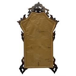 18th century design gilt framed wall mirror, within a pierced and scrolling foliate frame, leaf sprays and flowerhead cresting