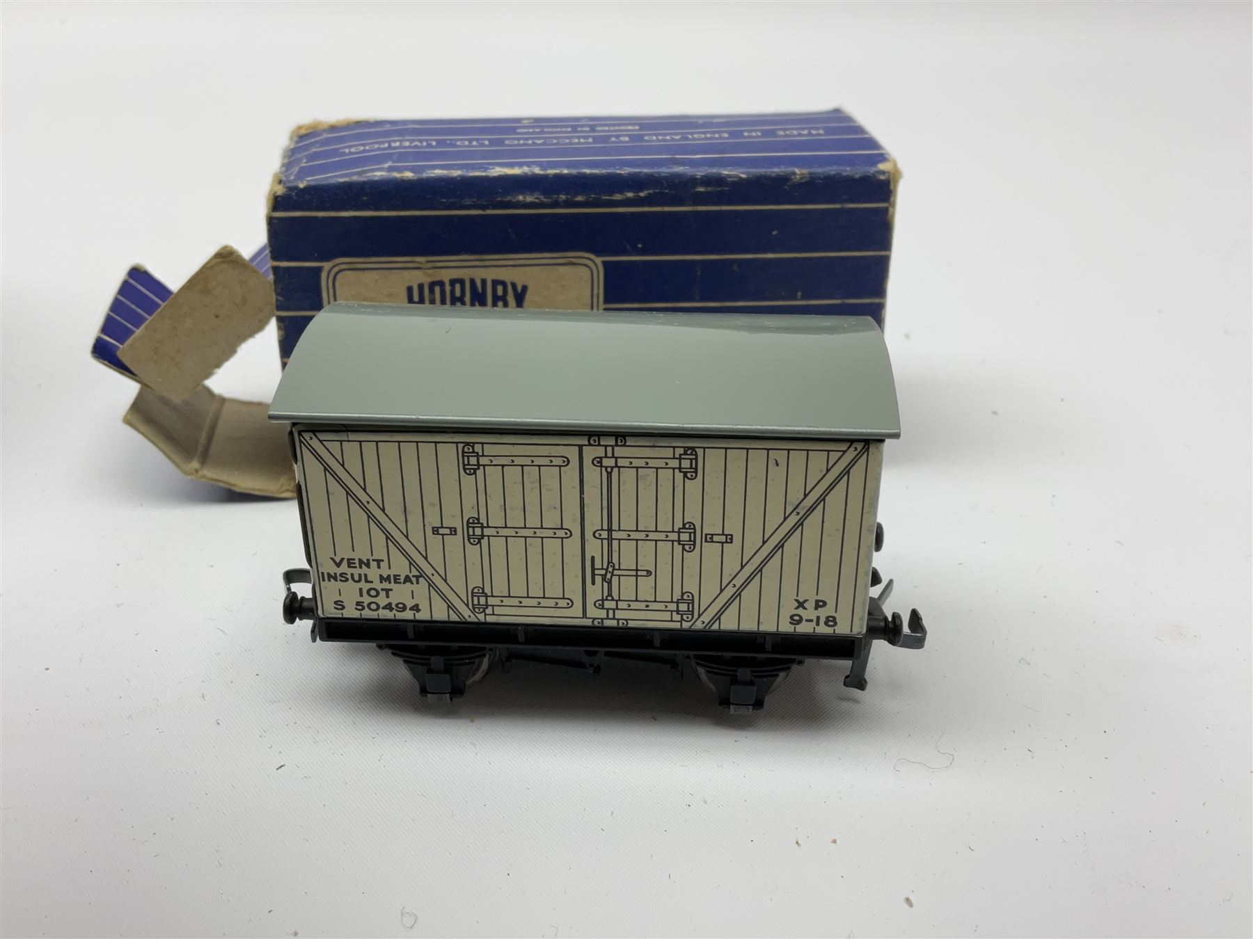 Hornby Dublo - twenty wagons including Cattle Trucks; Low-Sided Wagons; Cable Drum Wagons; Tank Wagon for Shell Lubricating Oil; Mineral Wagons; 20-Ton Bulk Grain Wagons; Goods Brake Vans; Furniture Containers etc; all in blue striped boxes (20)