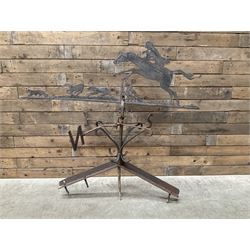 Black painted wrought iron weather-vane depicting hunting scene and compass points