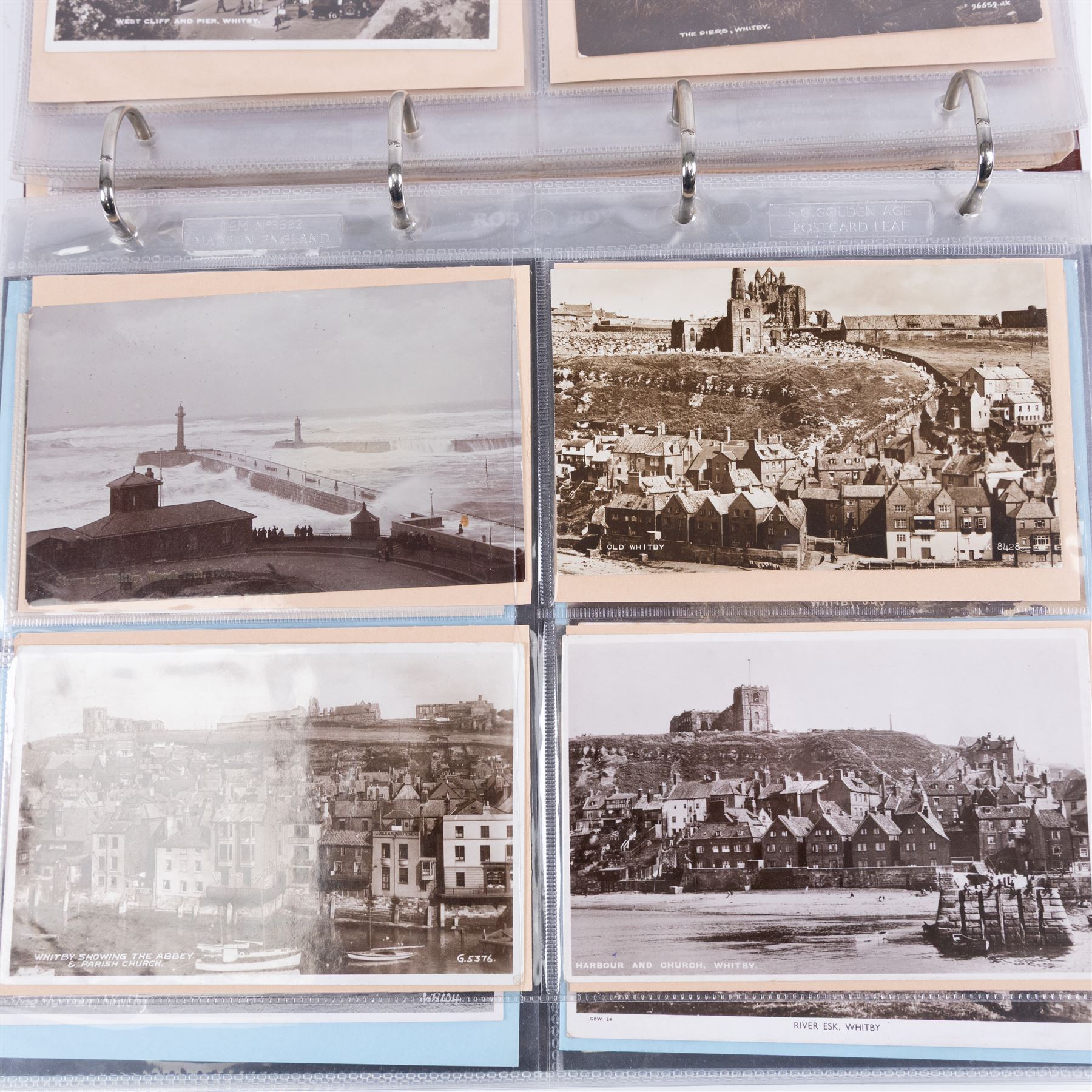 Two-hundred and thirty eight early 19th century to 20th century Whitby view postcards, including twenty-four early 19th century court cards, seventeen views of Whitby Abbey, forty depicting the fishing fleet and harbour, with a selection of cards providing a detailed study of the early 'Yards' the fisherman's dwellings around the harbour, all housed within a Stanley Gibbons Picture Postcard Album