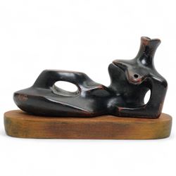 After Henry Moore (British 1898-1986): 'Reclining Figure', terracotta maquette sculpture, base marked with affixed catalogue label inscribed ‘Reclining Figure: 1939 Archive 0074229', W20cm H12cm
Notes: the original is on display at the Tate Britain