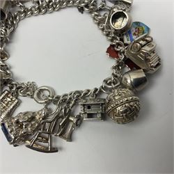 Silver charm bracelet, with twenty eight charms, including typewriter, rocking chair, carriage, cauldron, etc