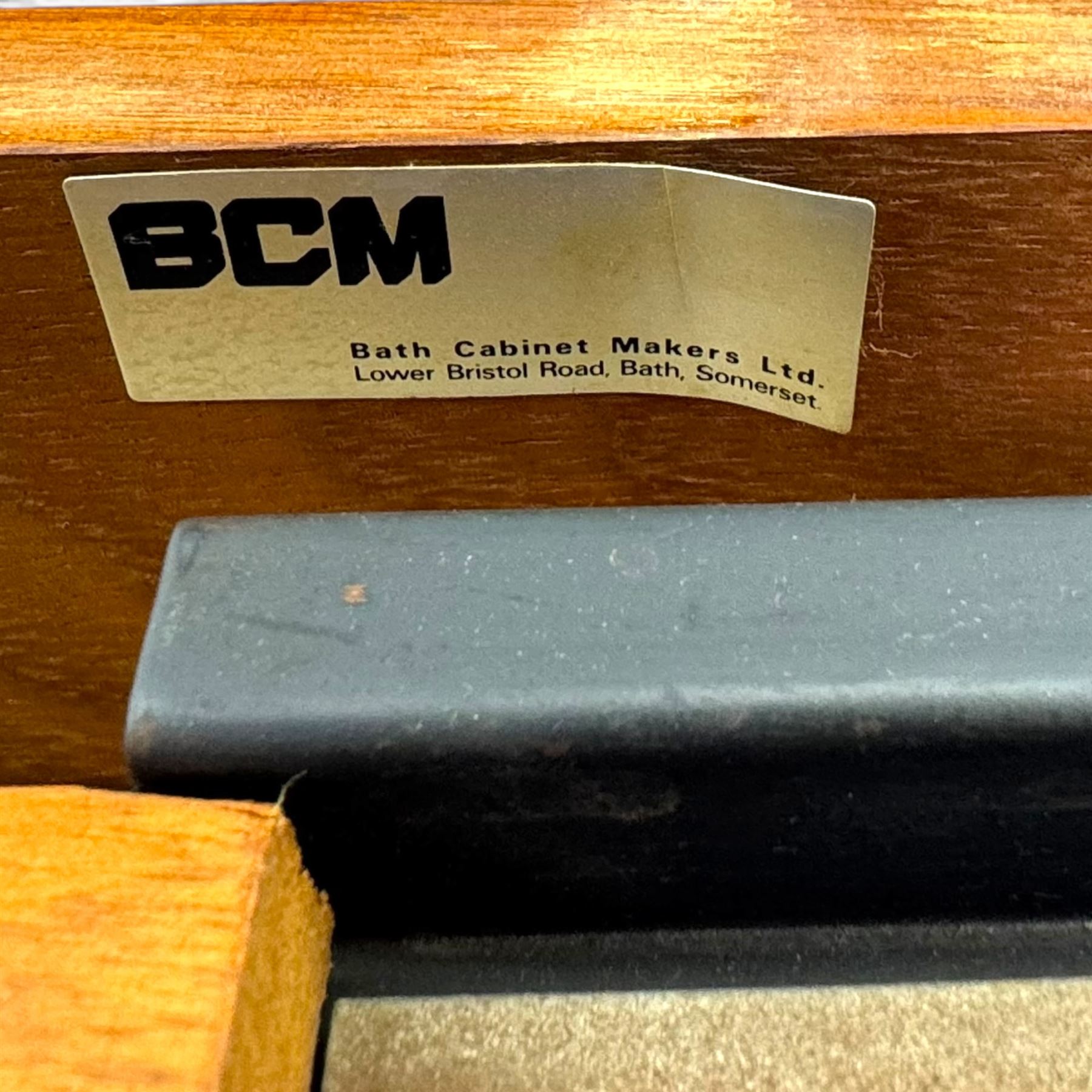 BCM (Bath Cabinet Makers) - mid-20th century teak extending dining table with BCM set of four teak dining chairs with bar back and black vinyl seats