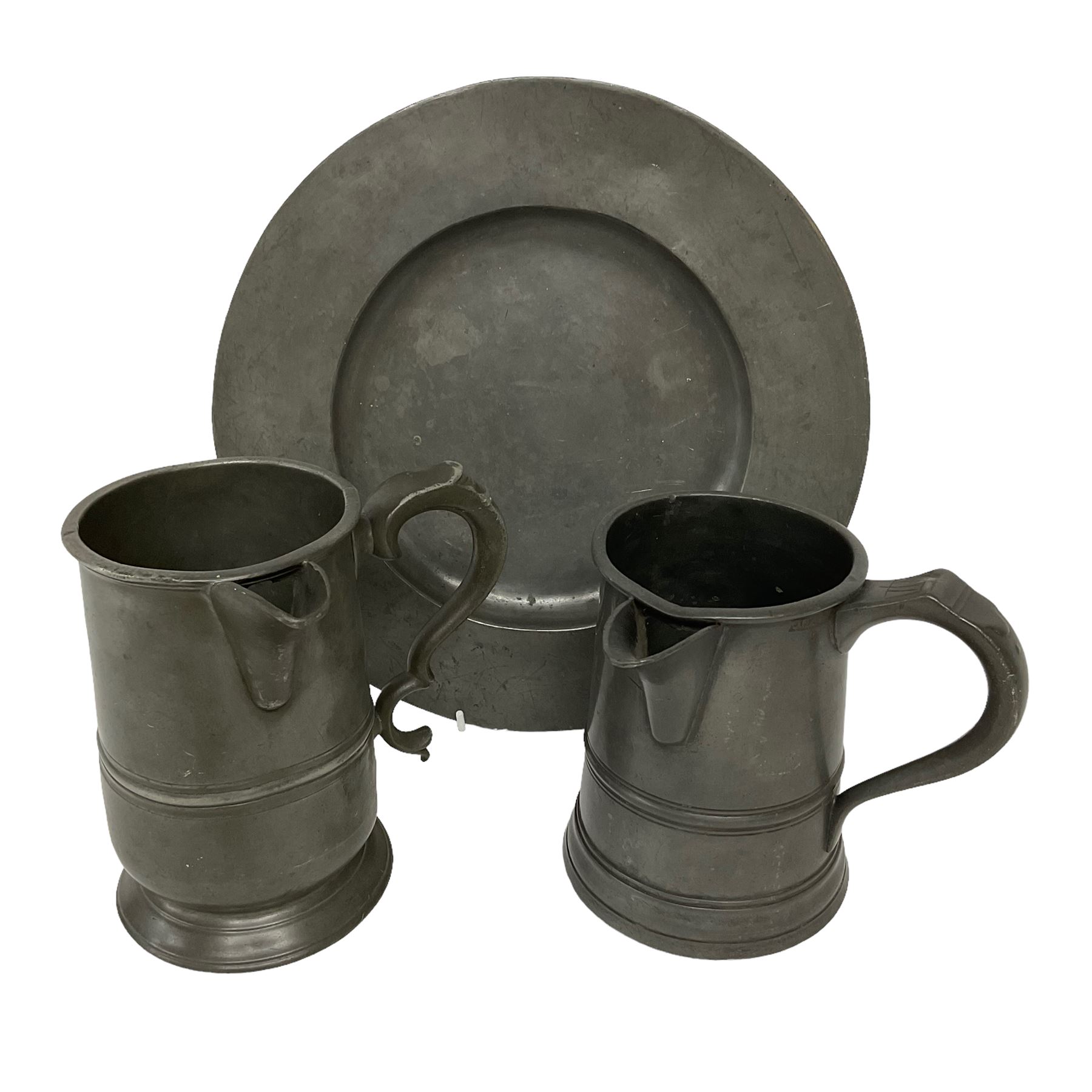 18th century pewter plate, with stamped London Superfine and crowned rose mark verso, together with two 19th century pewter side pouring tavern quart mugs, each indistinctly engraved (one 'R Harding Feathers')