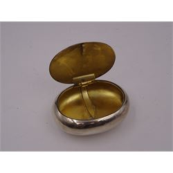 Early 20th century silver squeeze action snuff box, of oval form, engraved verso C.F. Rockcliffe, Darlington, the hinged lid engraved with initials CF and the crests for both Harrow School and Eton College, opening to reveal a gilt interior, hallmarked George Unite, Birmingham 1919, L8cm
