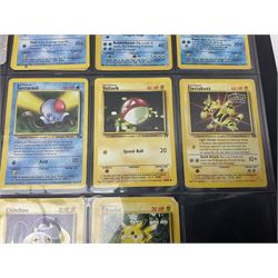 Collection of Pokemon trading cards, mostly 1999 Wizards Pokemon cards to include holo Charizard 4/102, first edition holo Machamp 8/102, further holographic cards; Dark Flareon 35/82 and Dark Vaporeon 45/82, cards from themed sets and 4th edition prints; 1998 Electronic Pokédex with cardboard boxes for themed decks Blackout, Overgrowth and Power Reserve Jungle, along with a large quantity of energy and trainer cards 