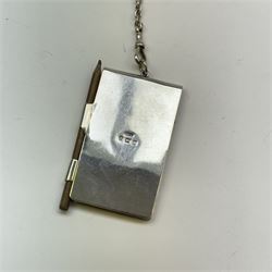 Victorian and later silver chatelaine, the shaped and foliate pierced clasp with embossed oval panel of a courting couple, hallmarked Levi & Salaman, Birmingham 1899, supporting six accessories on five chains: a circular mirror embossed with putti, hallmarked Henry Matthews, Birmingham 1911, pencil holder engraved with foliate scrolls, hallmarked Francis Webb, Birmingham 1914, conical scent bottle decorated with bamboo, (unmarked but testing as silver), aide memoire embossed with putti, hallmarked Samuel M Levi, Birmingham 1911, tape measure of compressed spherical form, hallmarked Henry Matthews, Birmingham 1899, and a purse with embossed putti, hallmarked Birmingham 1909, makers mark worn and indistinct, at longest point L31cm

