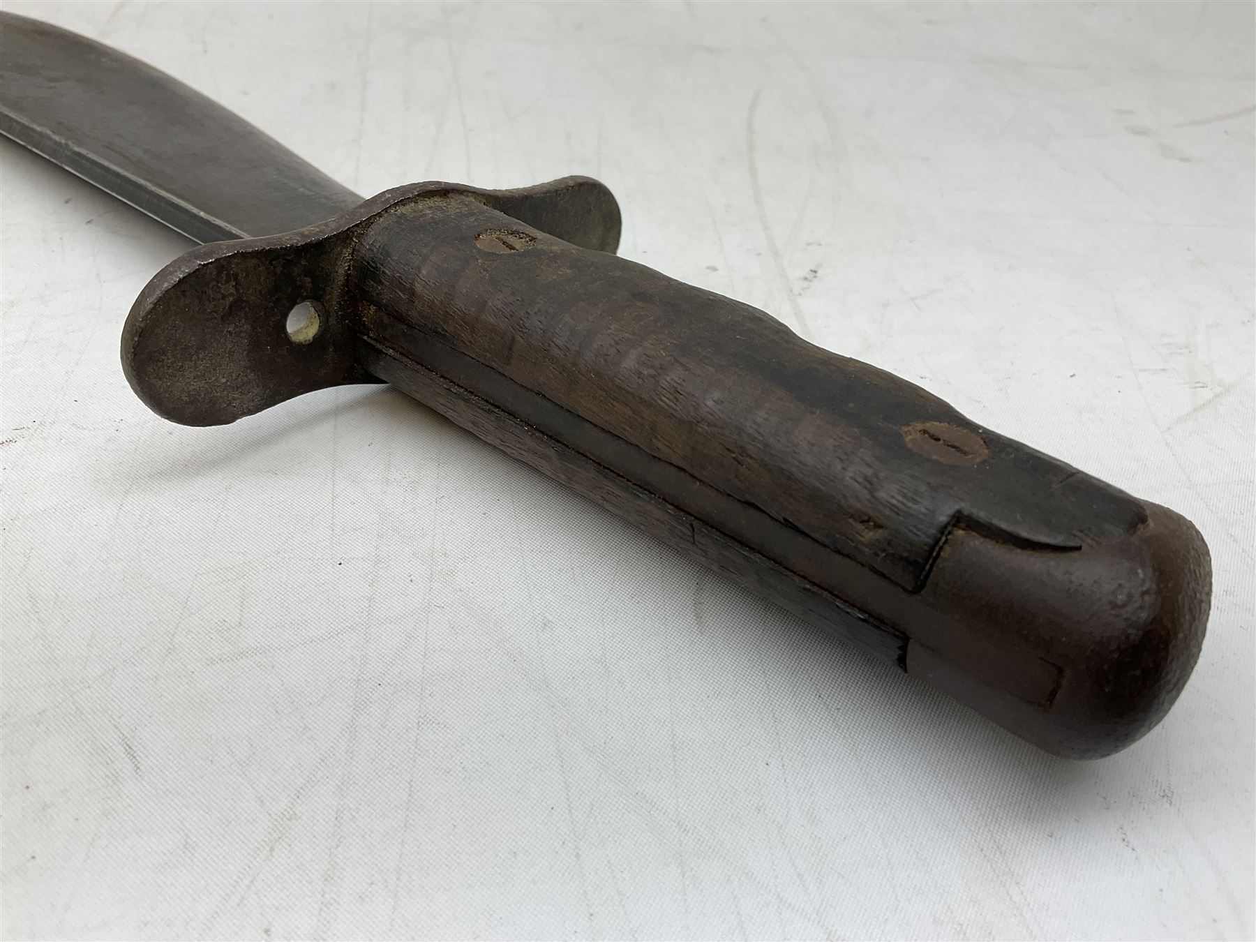 US Model 1910/17  Machine Gunners Bolo knife, the 26.5cm curving steel blade marked 'US MOD 1917 PLUME PHILA 1918'; in webbing covered steel scabbard with leather chape marked 'Brauer Bros 1918' L40.5cm overall (with photocopy of modern reference material)