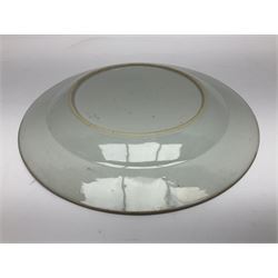 Three 18th century Chinese Famille Rose plates, the first example enamelled with blossoming peonies, rockwork and fence, the other two examples of similar design, decorated with blossoming peonies and sprigs within shaped inner borders, each approximately D23cm