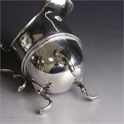 Late Victorian silver helmet shaped cream jug, with acanthus capped handle and upon three pad feet, hallmarked Birmingham 1898, maker's mark worn and indistinct, probably T Beardsmore, H10cm
