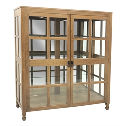 'Foxman' large oak and glazed display cabinet, two doors enclosing three glass shelves and mirrored back, by Don Craven of Oldstead, Thirsk, W154cm, H169cm, D47cm
