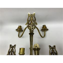 Set of six brass gilt wall sconces, each with two curved branches rising from tapering backplates, H24cm