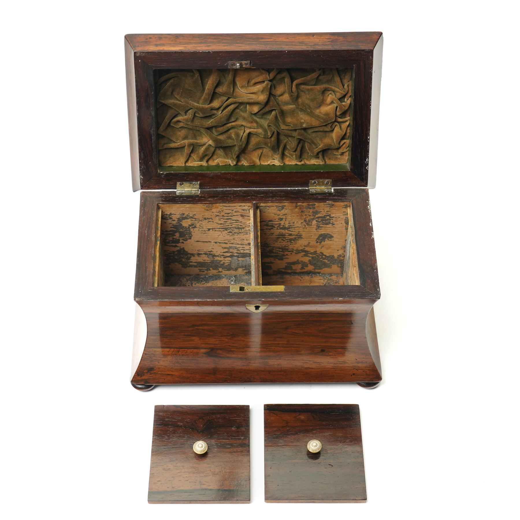 Early 19th century rosewood tea caddy of waisted sarcophagus form, twin compartments, on compressed bun feet, brass keyplate, H17cm W22cm 