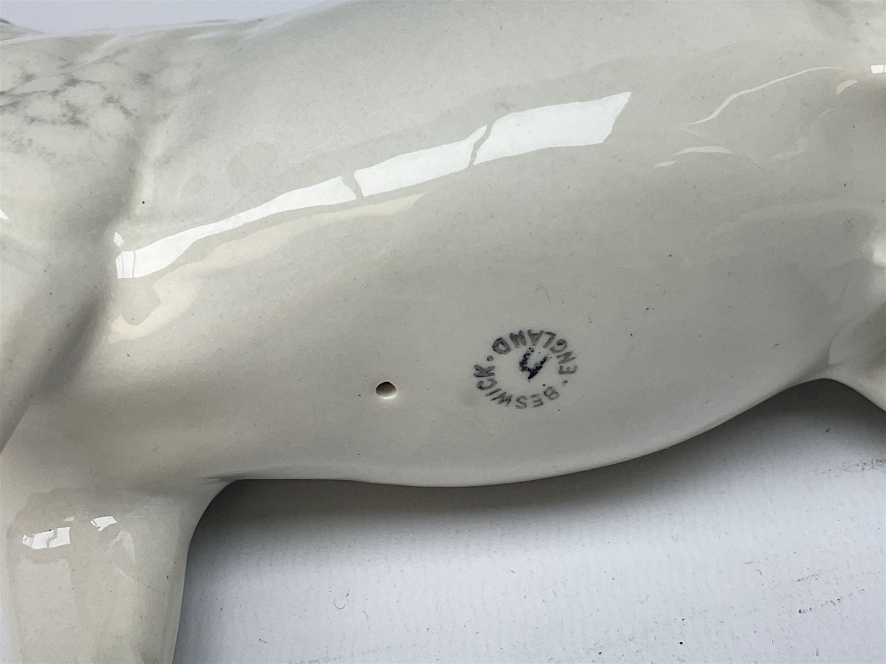 Collection of Beswick horses, including grey horse no.701, palomino foal no 836, grey stocky jogging mare no.855 etc, together two Royal Doulton horses, (8)