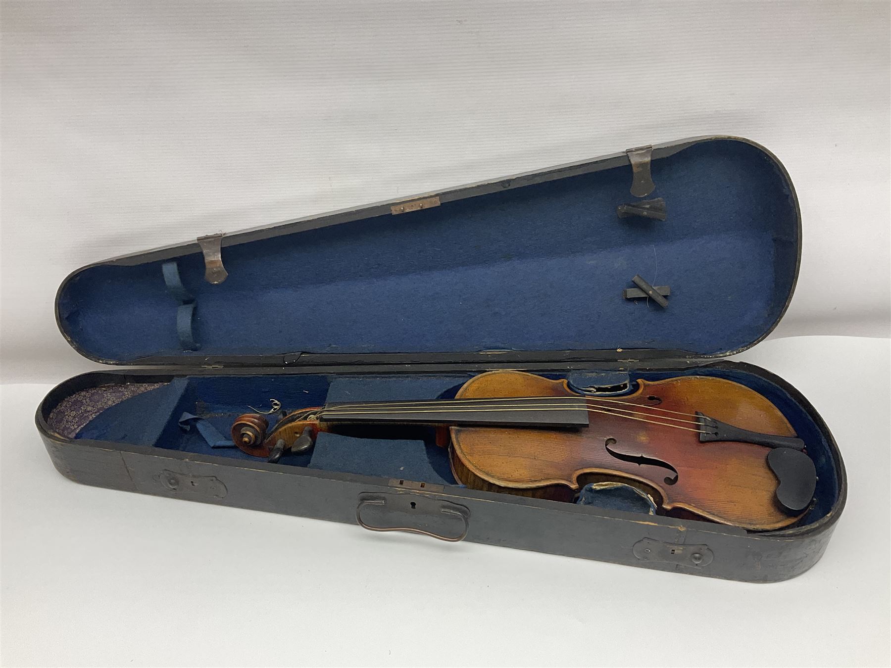 Late 19th century French three-quarter size 'Conservatory' violin with 34cm two-piece maple back and ribs and spruce top, the peg box inscribed 'Conservatory Violin Straduari', bears label 'Antonius Stradiuarius Cremonensis Faciebat Anno 1721' L55.5cm overall; in ebonised wooden 'coffin' case; and Saxony violin c1900 with 36cm two-piece maple back and ribs and spruce top; bears label 'Antonius Stradivarius Cremonensis Faciebat Anno 17**' L59cm overall; in carrying case (2)