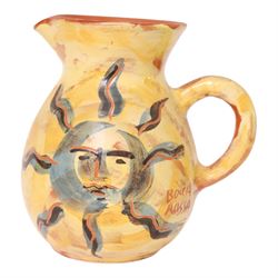 Vallauris French pottery by Patrick Bocca Rossa, jug painted with sun motifs upon a yellow ground, and an octagonal plate with a face to the center, both signed, jug H22cm 