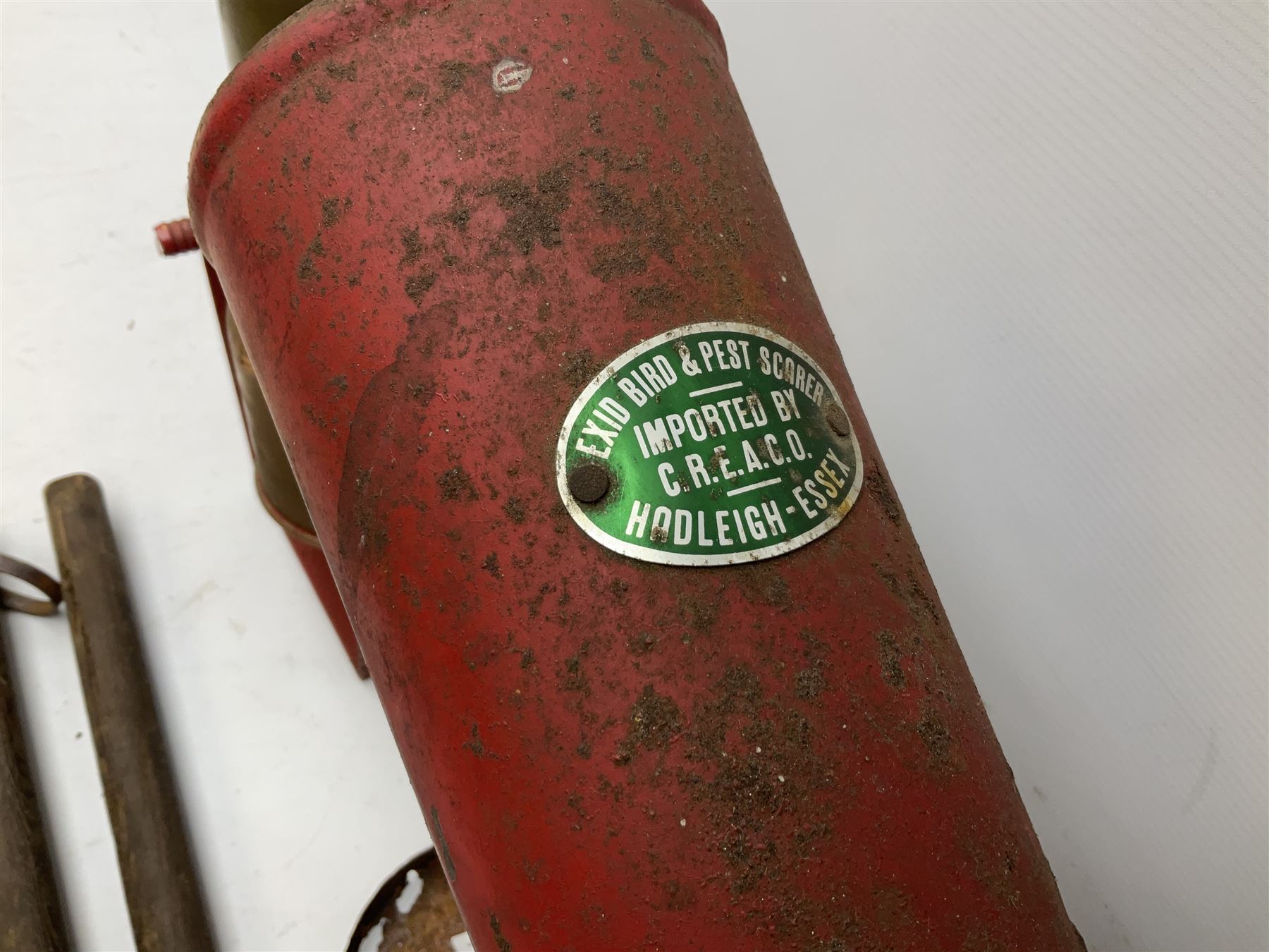 Blue and red painted gas powered bird / pest scarer, bearing label 'Exid bird & pest scarer, imported by C.R.E.A.C.O Hadleigh, Essex', , copper and brass Cymag gas hand pump, three eel spears and a set of badger tongs. Auctioneer's Note: These traps are sold as artefacts for ornamental purposes only as the use of some of them is illegal.