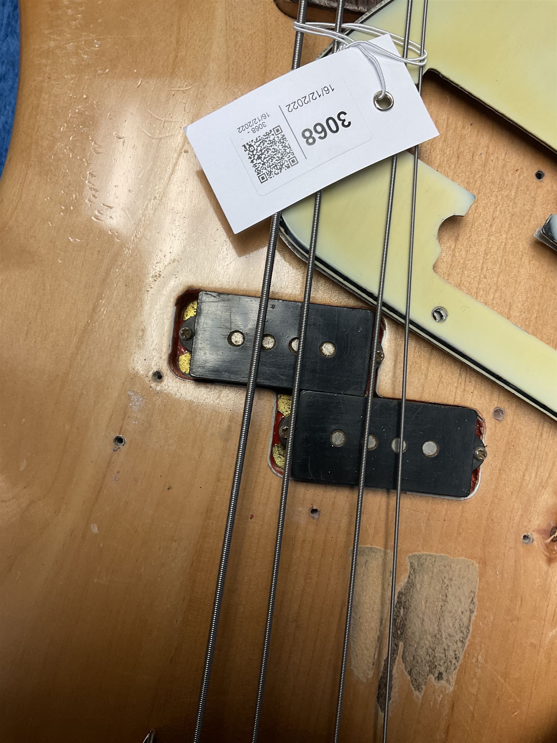 1962 Fender Precision bass guitar; re-finished in natural alder in the 1970s; impressed date code 5NOV62C to end of neck and serial no.90537 to back plate; L115.5cm; in replacement hard carrying case