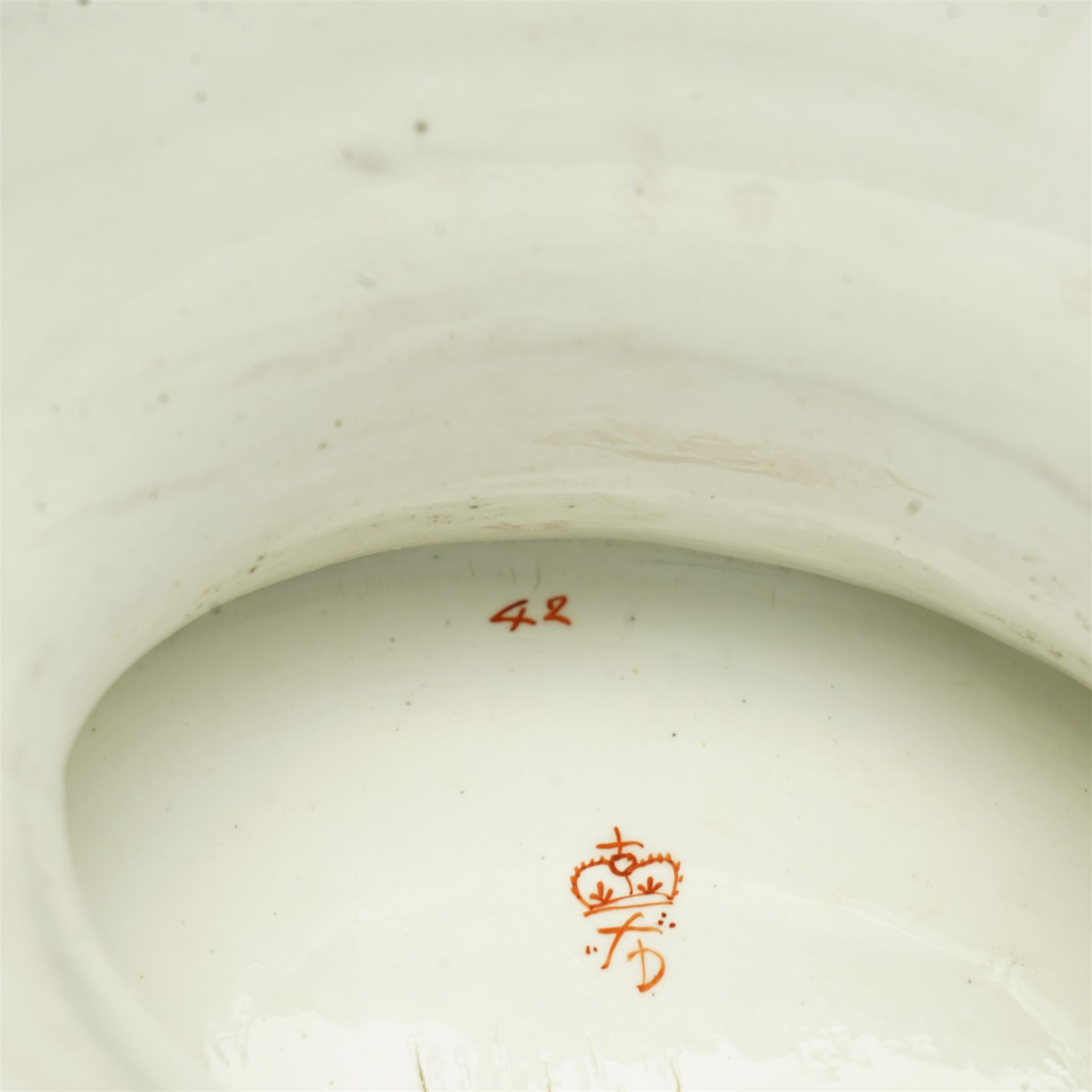 Early 19th century Derby comport of shaped oval design, the interior painted with a large spray of Spring flowers, the gilt border with a continuous band of flower heads repeated on the oval foot, red painted mark, pattern 42 L34cm