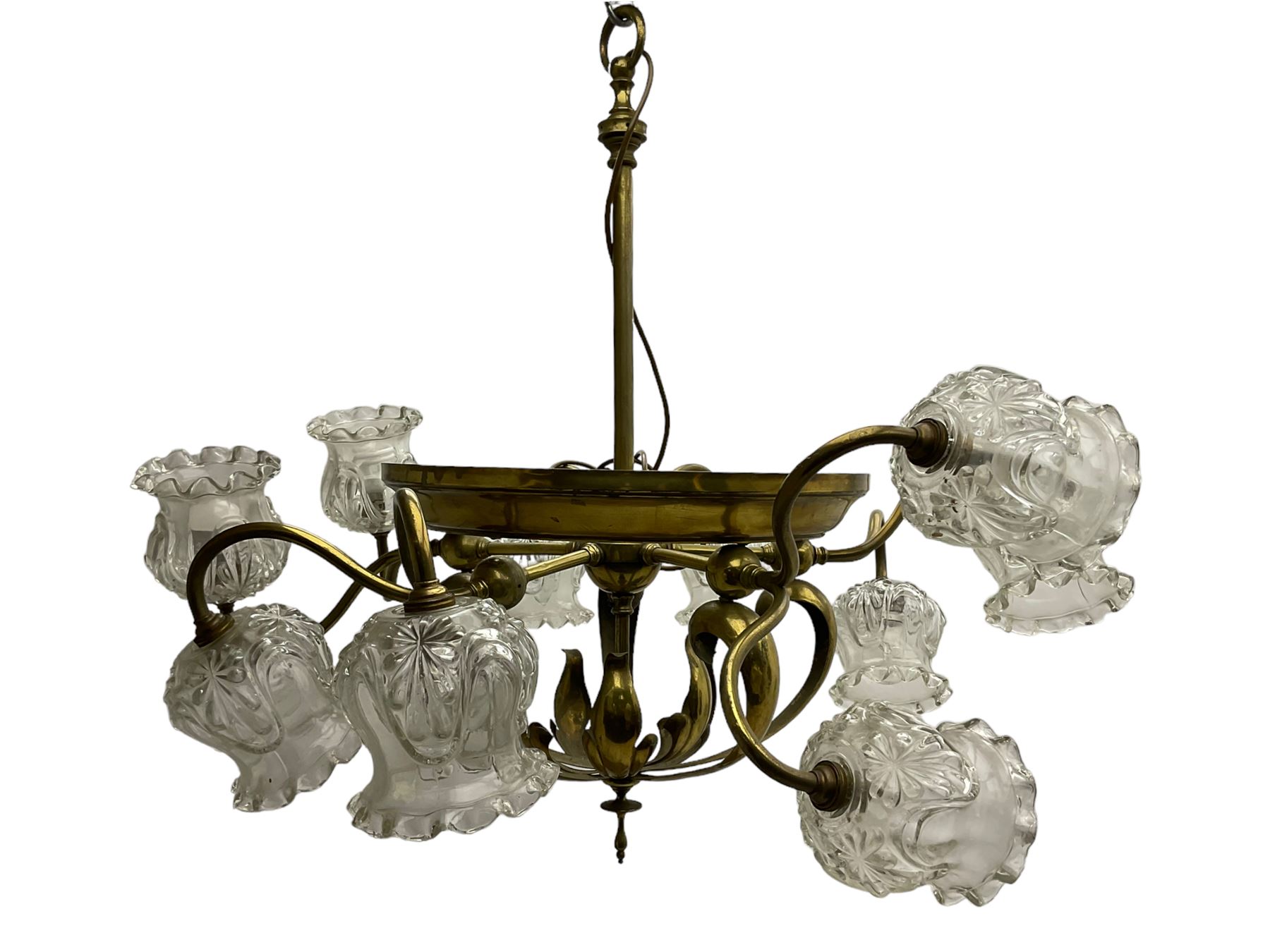Mid-20th century brass lightolier or light fitting, the scrolling foliate branches connected with a central ring, terminating in ten tulip shaped cut glass sades, pointed terminal beneath