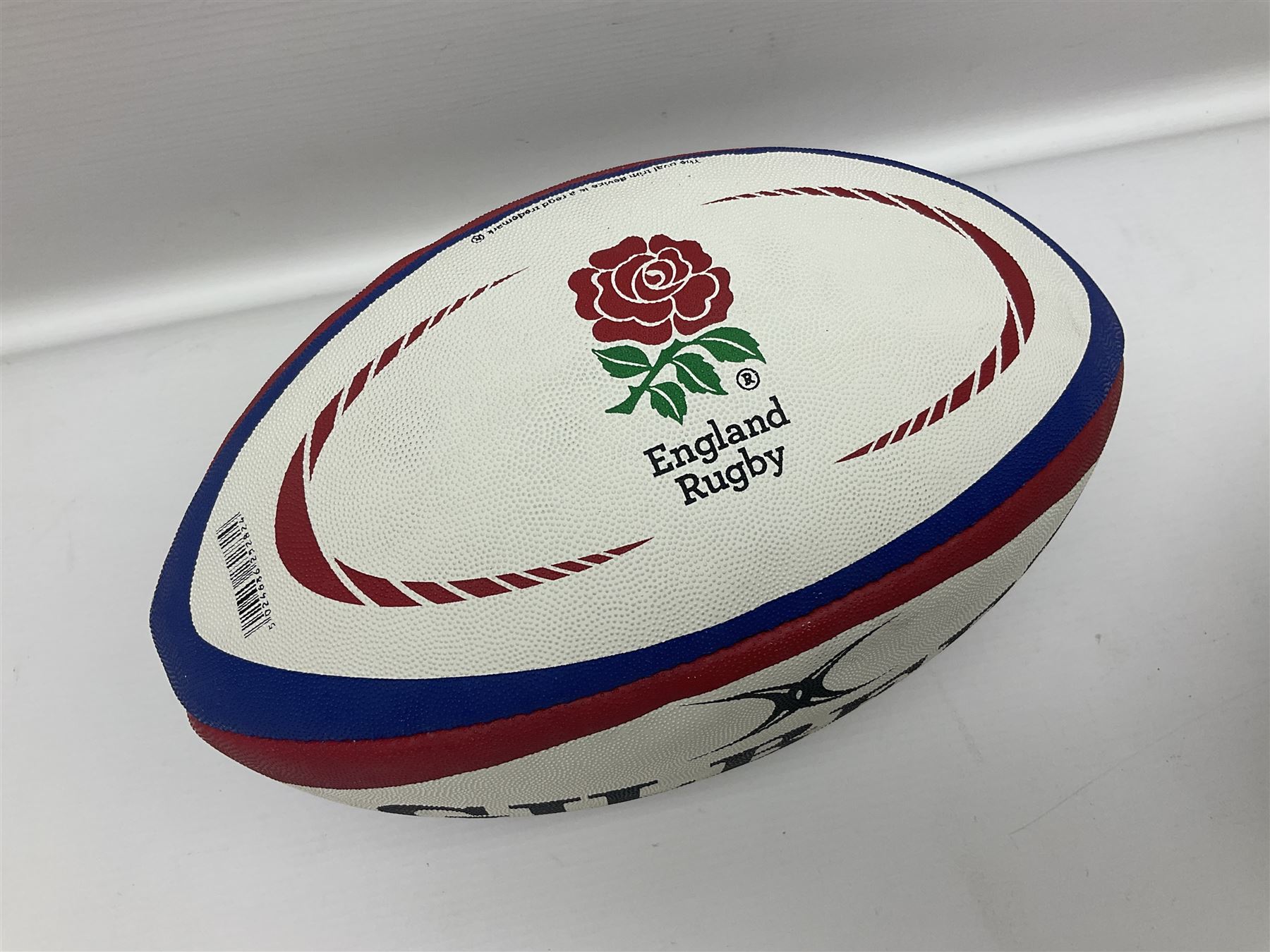 England Rugby official replica ball by Gilbert signed by Mike Tindall, together with a FIFA football
