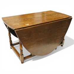 George III oak drop-leaf oval dining table with harlequin set of seven 18th century and later chairs including a comb-back Windsor, the table with turned gatelegs united by box stretcher, shaped apron extending to 212cm, the chairs of various forms, three Windsor carvers, a comb-back Windsor, plus a set of three Georgian mahogany dining chairs, pierced splat backs, with matching drop-in upholstered seats