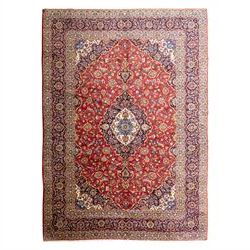 Central Persian Kashan hand-knotted carpet, crimson central field with lobbed medallion in...