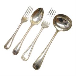 Oak table top canteen cabinet, the top with inset vacant brass cartouche, with pair of panelled doors opening to reveal four interior drawers with inset brass handle, containing a selection of silver plated flatware, 29cm x 40cm x 51cm