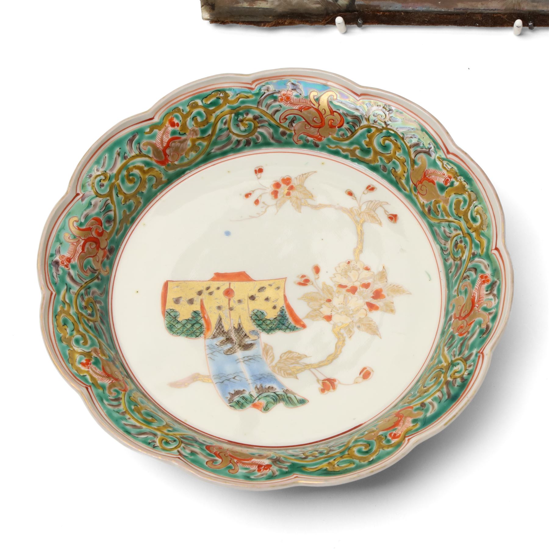 Chinese watercolour on rice paper, within a feathered surround 18cm x 19cm Asian bronze mirror, with dragon decoration D12cm Japanese dish, carved wooden bird and other items
