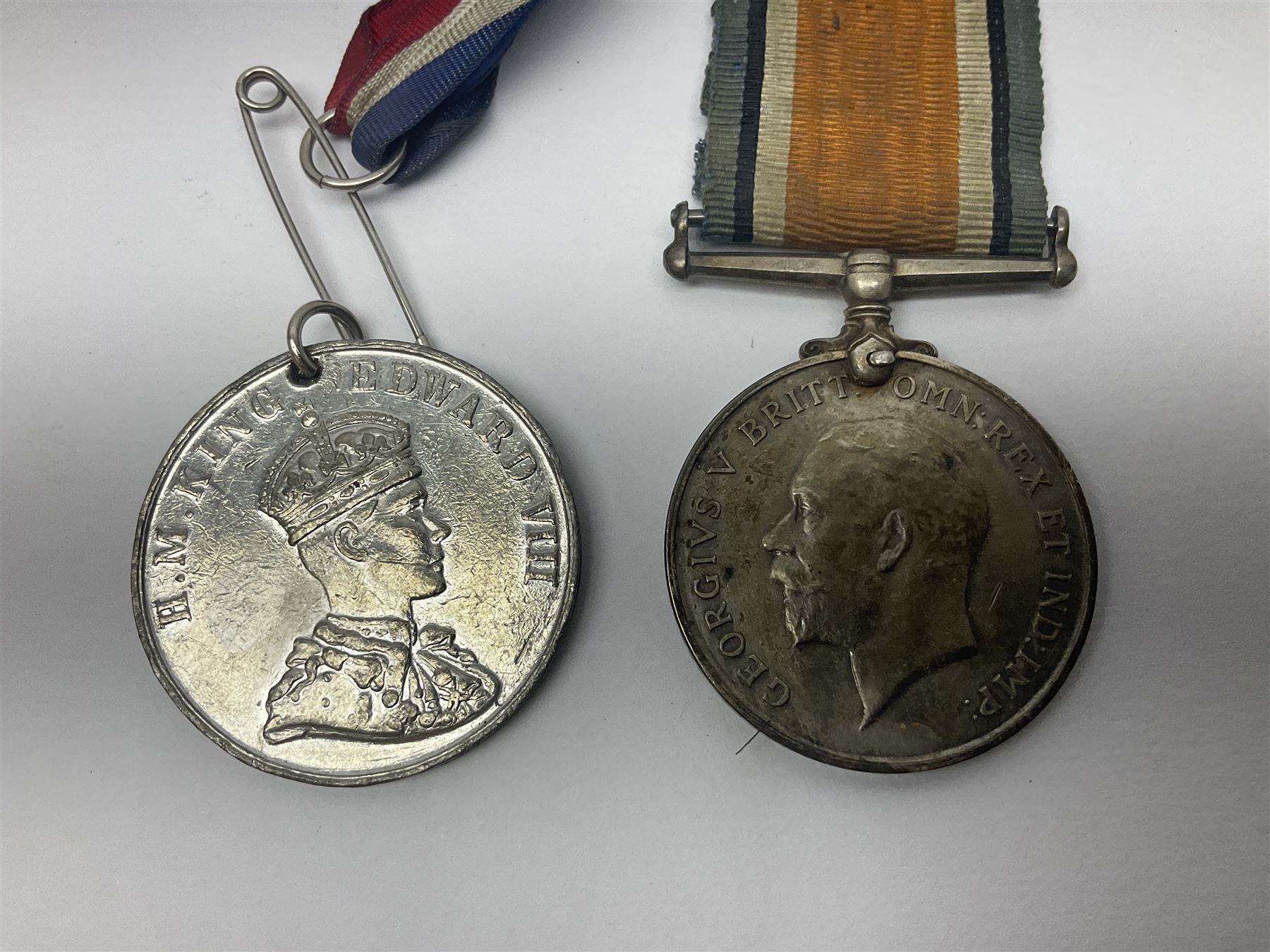 WW1 pair of medals comprising British war medal and Victory Medal awarded to 19774 Pte. G. Headlam Sea. Highrs.; another WW1 pair of medals comprising British War Medal and Mercantile Marine Medal awarded to Charles Filburn; WW2 group of five medals comprising 1939-45 War Medal, Defence Medal, 1939-45 Star, Africa Star and Burma Star; in issue box addressed to Mr. H, Smithson with medal slip; all with ribbons; and Edward VIII Coronation medal (10)