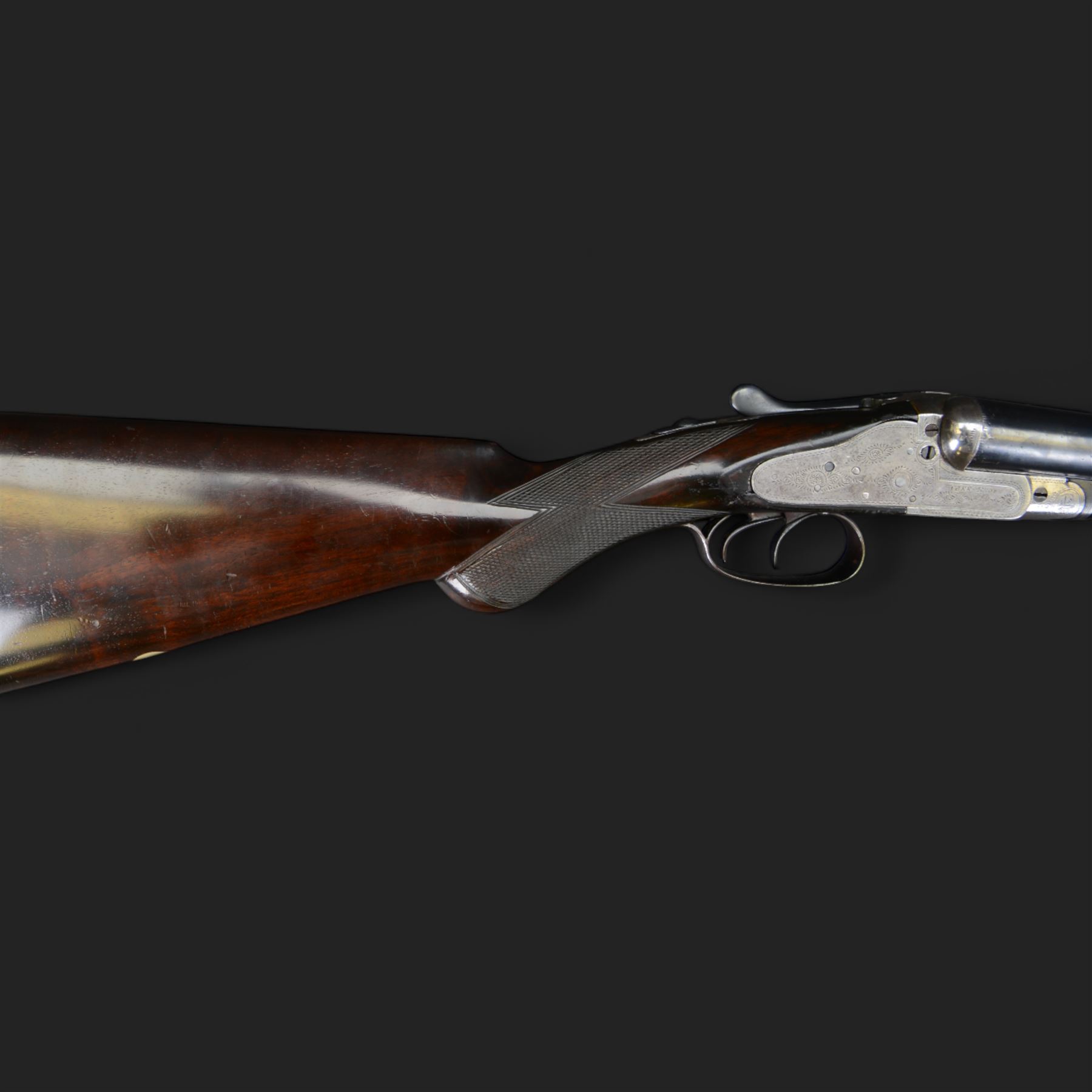 Carr Brothers of Huddersfield 12 bore side by side shotgun with engraved sidelock plates, trigger guard, underside, top plate, thumb lever and fences, chequered semi-pistol grip and horn tipped forend, vacant cartouche to the underside of the stock, double trigger and named 28 inch sleeved barrels choked ¾ and ½, overall length 113cm SHOTGUN CERTIFICATE REQUIRED