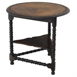 19th century country oak circular occasional table, featuring three triangular drop leaves...