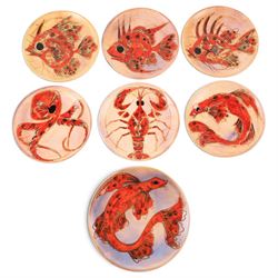 Monique Brunner - earthenware plates, decorated with fish and shellfish, upon a pink and c...