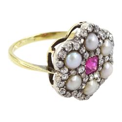Early 20th century 18ct gold and silver ruby, diamond and pearl flower head cluster ring, single octagonal cut ruby of approx 0.30 carat, with old cut and rose cut diamond and split pearl surround