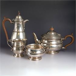 1920s four piece silver tea service, comprising hot water pot, teapot, sugar bowl and milk...