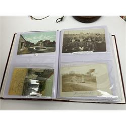 Postcards including WW1 silk postcards, local interest and photographic postcards, gas mask in box, material tape measure and metal sign. 