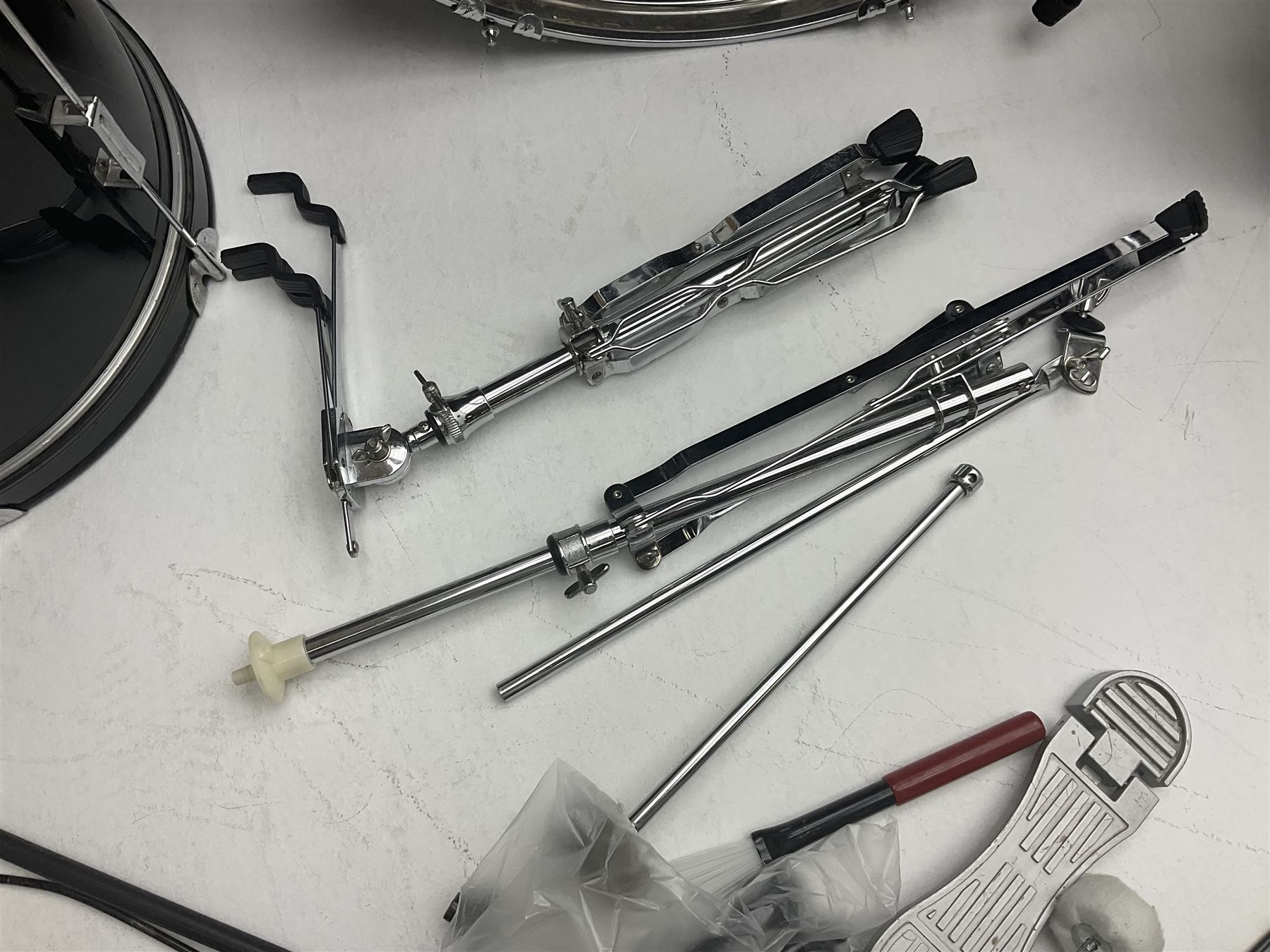 Rockburn eight-piece black drum kit with bass drum, floor tom and five other toms and snare drum; together with two other snare drums; Haosen bass drum; four cymbals; various stands, foot pedals, stool, tri-angle, drum sticks etc