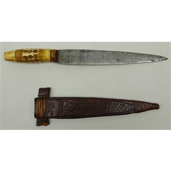  Inuit Hunting knife, 21cm twin edge tapering blade, ribbed and draught carved bone handle, in dot prick decorated leather sheath, L32cm   