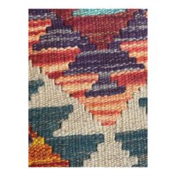 Afghan Maimana flatweave Kilim rug, the field decorated with multi-coloured diamond motifs in a stepped formation, framed by a bold hourglass border,
