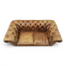 HALO - Chesterfield style two seat sofa upholstered in buttoned brown leather with stud work, on turned feet with castors